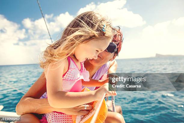 girl enjoying a trip on catamaran - mauritius stock pictures, royalty-free photos & images