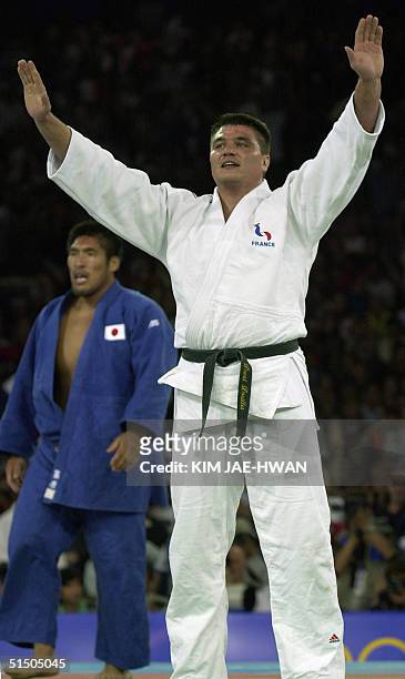 French gold medal judo winner David Douillet jubilates after defeating Shinichi Shinohara of Japan in the Judo heavyweight 100 kg finals at the...