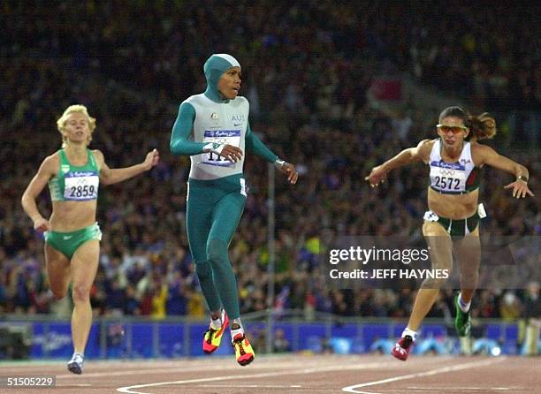 Australia's Cathy Freeman wins the Olympic 400m final followed by South Africa's Heide Seyerling and Mexico's Ana Guevara in Sydney 25 September...