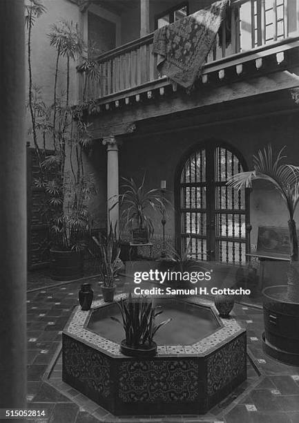 Exterior, small pool and fountain in the tiled patio of the White Plains, New York home of Mr. Albert Lyttle Dean; Eric Kebbon, architect.