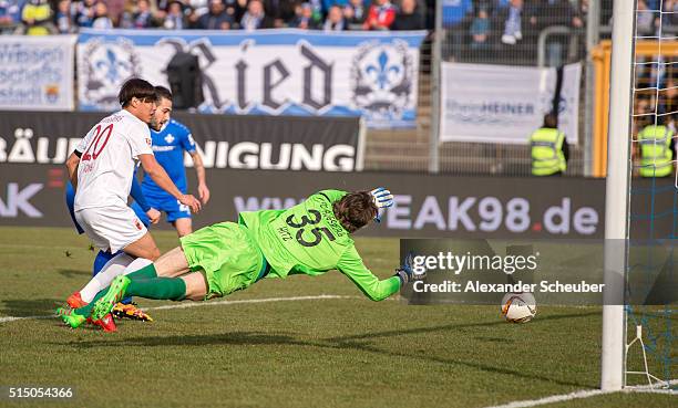 Mario Vrancic of SV Darmstadt 98 scores the first goal for his team against Marwin Hitz of FC Augsburg during the first bundesliga match between SV...