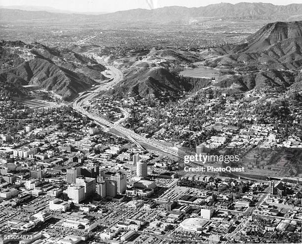 An aerial view of the Hollywood district , the Cahuengha Pass, and the San Fernando Valley gives some idea of the growth of Los Angeles which sprawls...