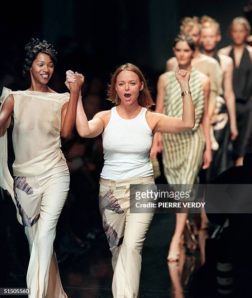 Stella McCartney, daughter of Beatles star, Paul McCartney, cheers the audience after the show for her label Chloe 11 October 2000 in Paris during...