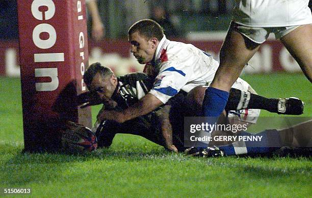 New Zealand Prop Quentin Pongia scores his sides a 2nd try against France, 12 November 2000, during their quarter final Rugby League World Cup match...