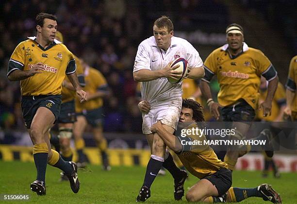 Mike Tindall of England is tackled by Australia's George Smith, 18 November 2000 at Twickenham, in the match that England won 22-19