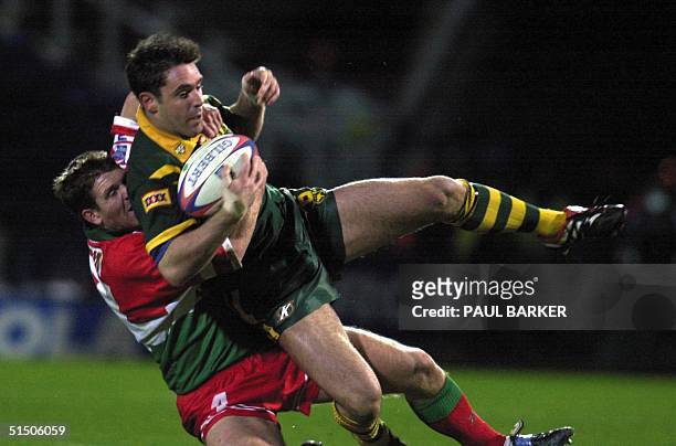 Australia's Craig Gower gets stopped by Wales's Jason Critchley in a Rugby League World Cup semi-final at Huddersfield 19 November 2000.