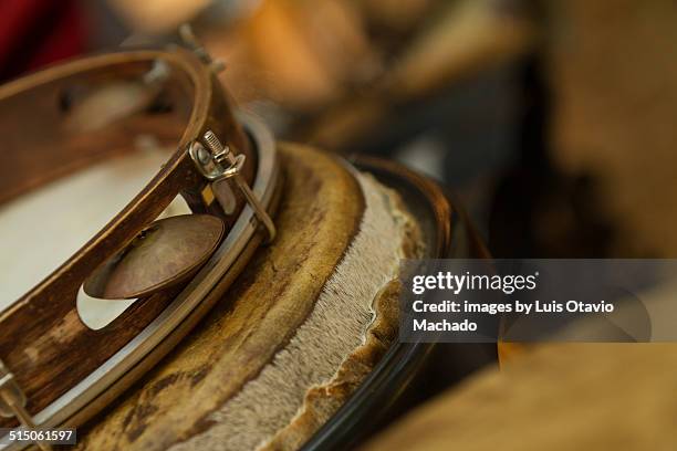 pandeiro and other leather percussion instruments - pandeiro fotografías e imágenes de stock