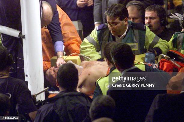 Paul Ingle is taken out of the ring on a stretcher after being stopped in the 12th round by challenger Mbulelo Botile during the IBF Featherweight...