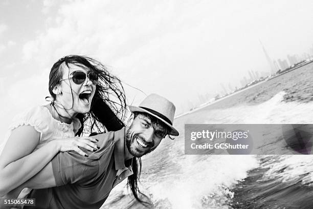 fun in dubai, couple on a yacht - black and white couple stock pictures, royalty-free photos & images