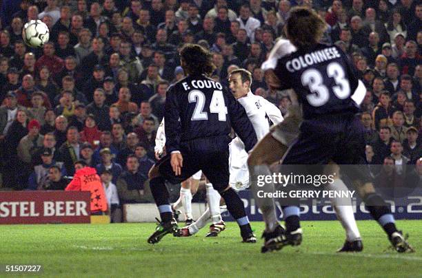 Leeds United midfielder Ian Bowyer scores Leeds first goal past Lazio's Fernando Couto and Francesco Colonnese 14 March 2001, during their EUFA group...