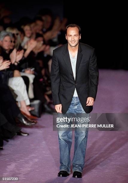 Designer Tom Ford acknowledges the audience after his show for Saint-Laurent Rive Gauche 14 March 2001 in Paris during the Autumn/Winter 2001/2002...