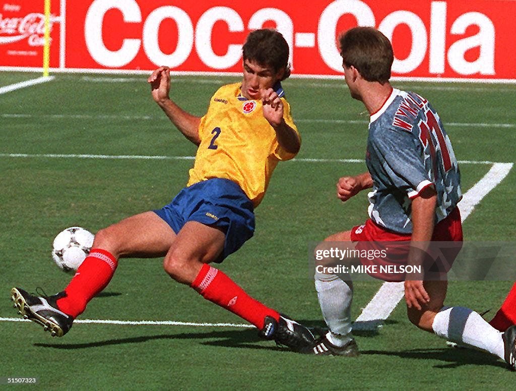 Colombian defender Andres Escobar (L) comes up sho
