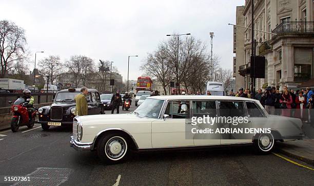 The Mercedes Benz 600 limousine formerly owned by John Lennon arrives at The Hard Rock Cafe in London 27 March 2001. The car, bought by Lennon in...