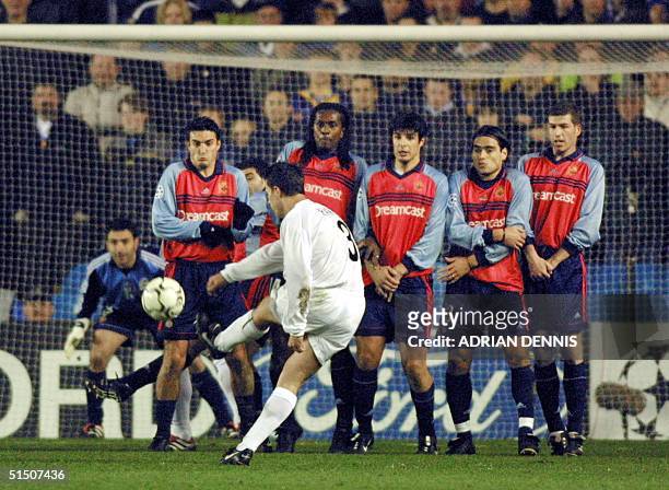 Leeds United's Ian Harte hits a free kick to score the opening goal while the Deportivo La Coruna defensive wall look on during their Champions...