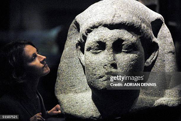 Sally-Ann Ashton admires one of the statues of Cleopatra at the launch of a new exhibition at The British Museum in London 10 April 2001. Ashton, a...