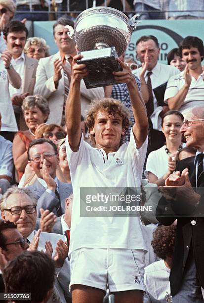 Swede's mats Wilander holds his tropy after winning the French Tennis Open at the Roland Garros stadium in Paris 06 June 1982.