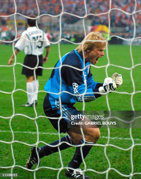 Bayern Munich's goalkeeper Oliver Kahn jubilates after he stopped Valencia's defender Amedeo Carboni penalty kick in the European football Champions...