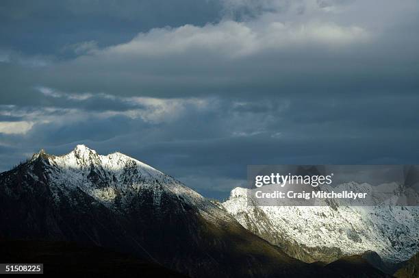 The sunlight streaks through the clouds onto the newly snowcapped foothills surrounding Mt. St. Helens on October 19 in Mount St. Helen's,...