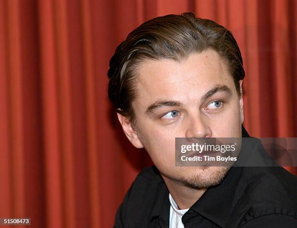 Actor Leonardo DiCaprio waits for his turn to speak to a group of John Kerry supporters October 19, 2004 in Tampa, Florida. DiCaprio told the crowd...