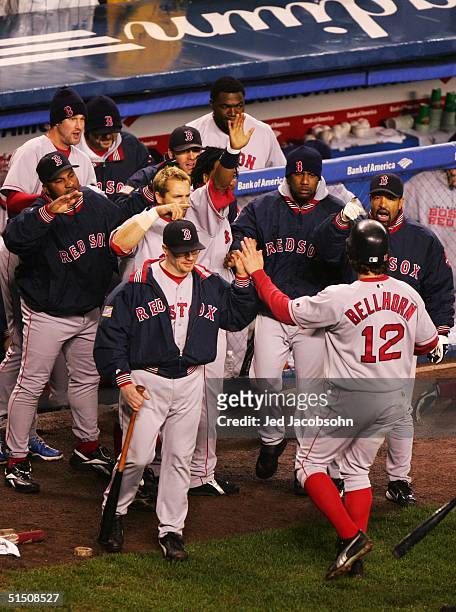 Mark Bellhorn of the Boston Red Sox is greeted by his teammates after hitting a two run home run against the New York Yankees in the fourth inning...