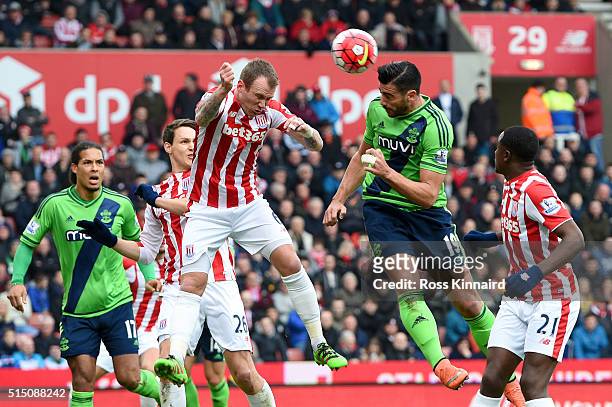 Graziano Pelle of Southampton heads the ball to score his team's first goal during the Barclays Premier League match between Stoke City and...