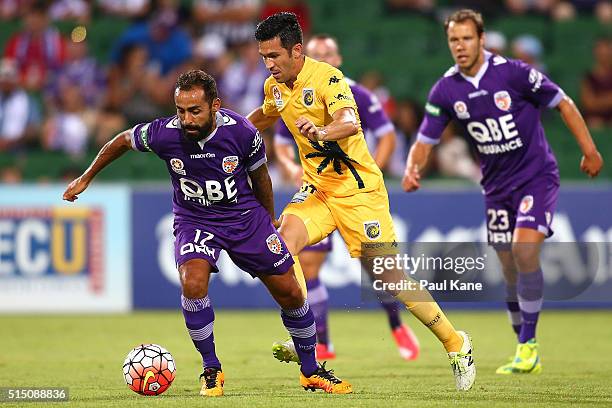 Diego Castro of the Glory controls the ball against Luis Garcia of the Mariners during the round 23 A-League match between the Perth Glory and the...