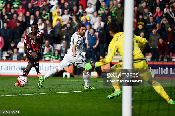 Max Gradel of Bournemouth scores his team's first goal past Lukasz Fabianski of Swansea City during the Barclays Premier League match between A.F.C....
