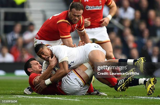 Anthony Watson of England is hauled down by Sam Warburton of Wales during the RBS Six Nations match between England and Wales at Twickenham Stadium...