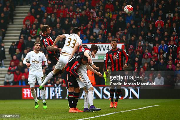 Steve Cook of Bournemouth heads the ball to score his team's third goal during the Barclays Premier League match between A.F.C. Bournemouth and...