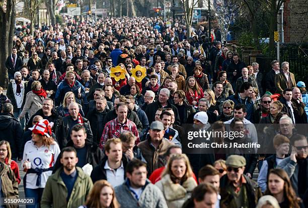 Two Welsh rugby fans are dressed as daffodils amongst the crowds making their way to the England v Wales 6 Nations fixture on March 12, 2016 in...