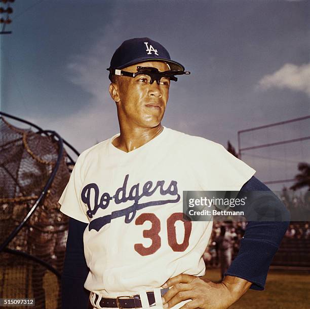 Maury Wills of the Los Angeles Dodgers is shown wearing glasses with head turned.