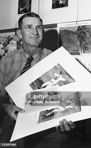 Sammy Baugh, who made career tossing trolley-wire passes of Texas Christian University and the Washington Redskins, looks over his three Houston...