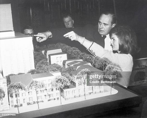 Architect John Carl Warnecke explains a model, for the restoration and development of Lafayette Square, to Mrs. Jacqueline Kennedy here today. Plans...