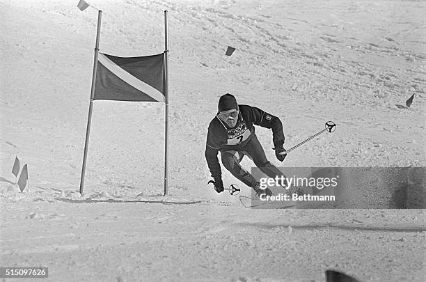 French skier Francois Bonlieu holds tongue between lips, as he concentrates on navigating the trail during a giant slalom of the '64 Winter Olympic...