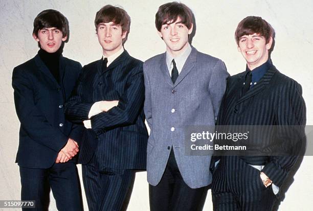 The Beatles posing together. From left to right: musicians George Harrison, John Lennon, Paul McCartney and Ringo Starr, circa 1965.