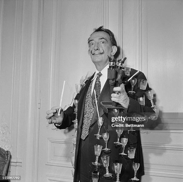 Eccentric artist Salvador Dali literally means what he says by, "the drinks are on me!" At a press party held in Paris, the well-known artist wore a...