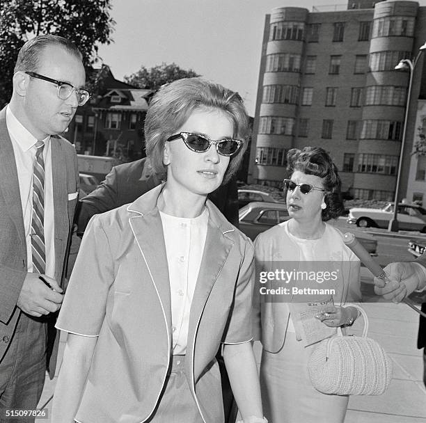 Marina Oswald arrives to testify at Warren Commission hearings into her husband's role in the assassination of President Kennedy.