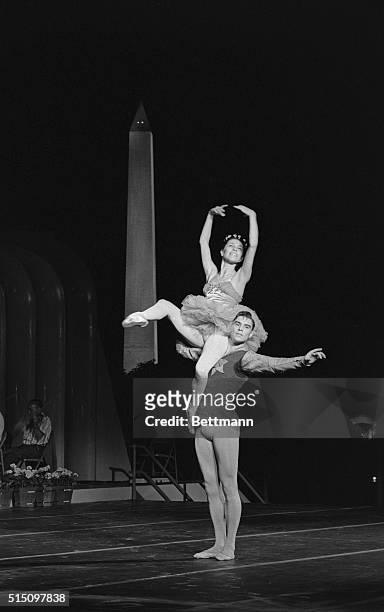 Maria Tallchief and Jacques d'Amboise are shown performing on the South Lawn of the White House tonight during a rehearsal for a program to follow...