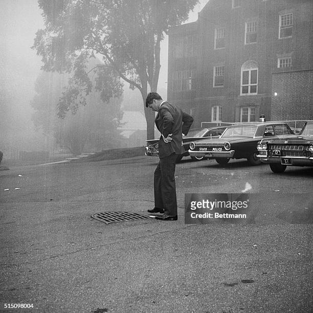 Attorney General Robert Kennedy is immersed in deep thought as he stands in fog-shrouded area outside Cooley Dickinson Hospital June 20th after...