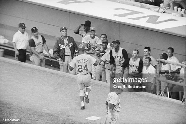 Tony Perez, Cincinnati Red infielder, heads for the National League dugout following his game winning 15th homerun. Left to right: Mazeroski,...