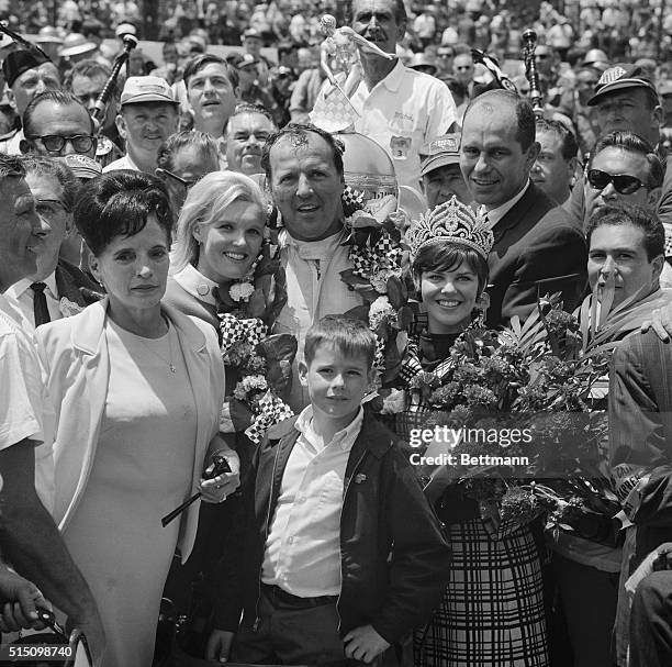 This happy little group that is feeing mighty big has much to be happy about. A.J. Foyt just won the Indianapolis 500-mile race and he is sharing his...