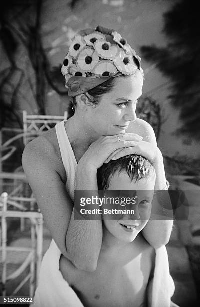On Vacation. Montego Bay, Jamaica: Princess Grace of Monaco is the picture of contentment as she relaxes at a poolside with her nine-year old son...