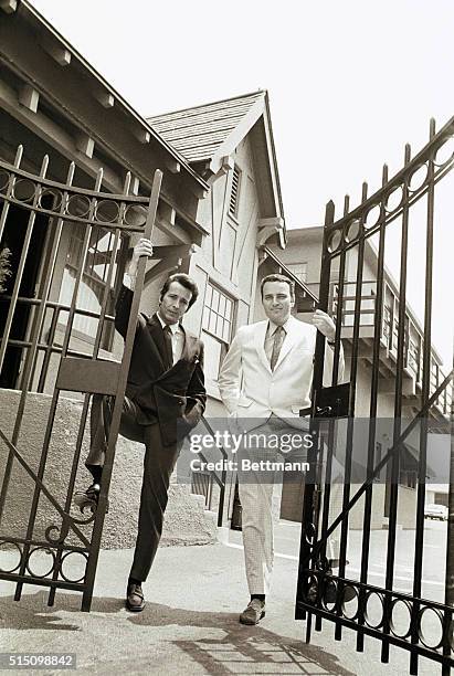 Herb Alpert and Jerry Moss, the owners and founders of A&M Records, at the gate of their new establishment.