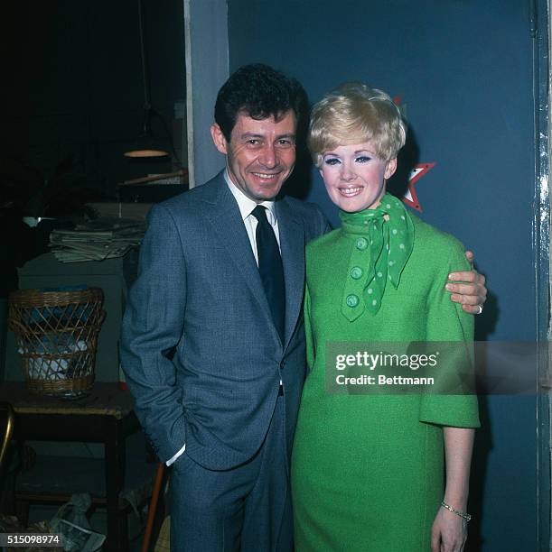 Eddie Fisher with his fiancee Connie Stevens backstage at the Plymouth Theatre, where she is starring in the show, The Star Spangled Girl. They will...