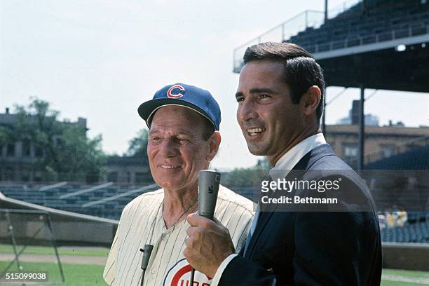 Sportscaster, Sandy Koufax, a former Los Angeles Dodger, here is interviewing Leo Durocher, the manager of the Chicago Cubs, on July 1st, at Wrigley...