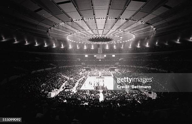 Under the magnificence of the well-lit roof of the new Madison Square Garden, college basketball made its debut. Playing the game in front of 5,214...