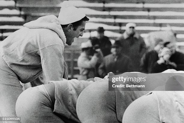 Dallas Cowboy quarterback Don Meredith yells out signals here, as he waits for the snap from center, as the Cowboys practices at Lambreau field for...