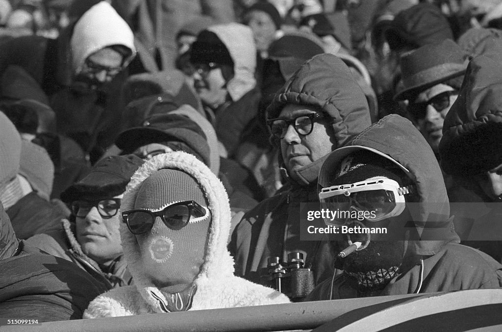 Bundled Up Fans Sitting at Football Game