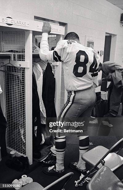 Dejected Dallas Cowboy is Pettis Norman, standing beside his locker after the Cowboys lost the NFL Championship game to the Green Bay Packers 21-17...