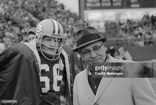 Ray Nitachke defensive captain of the Green Bay Packers, gets together with Coach Vince Lombardi on the sidelines during the Western conference...
